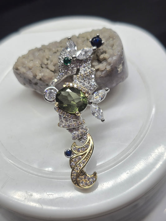 Moldavite seahorse pendant.